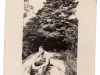 Man-Sitting-in-front-of-Bush