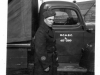 Man-in-Long-Coat-beside-Truck